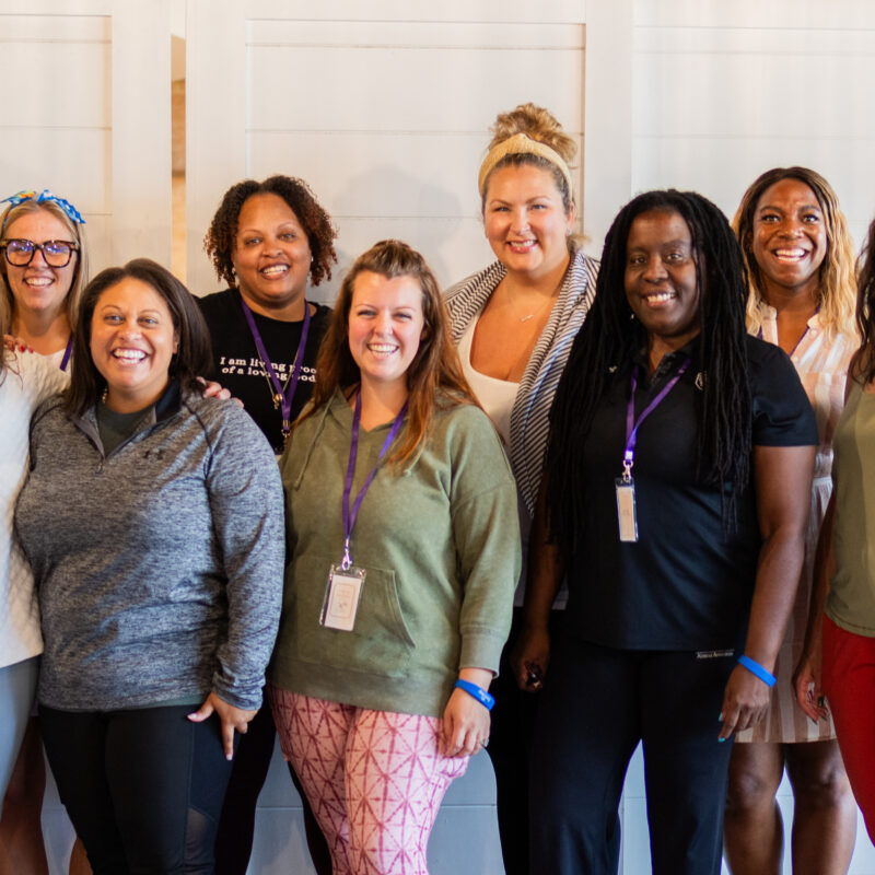 group of women posing for a photo