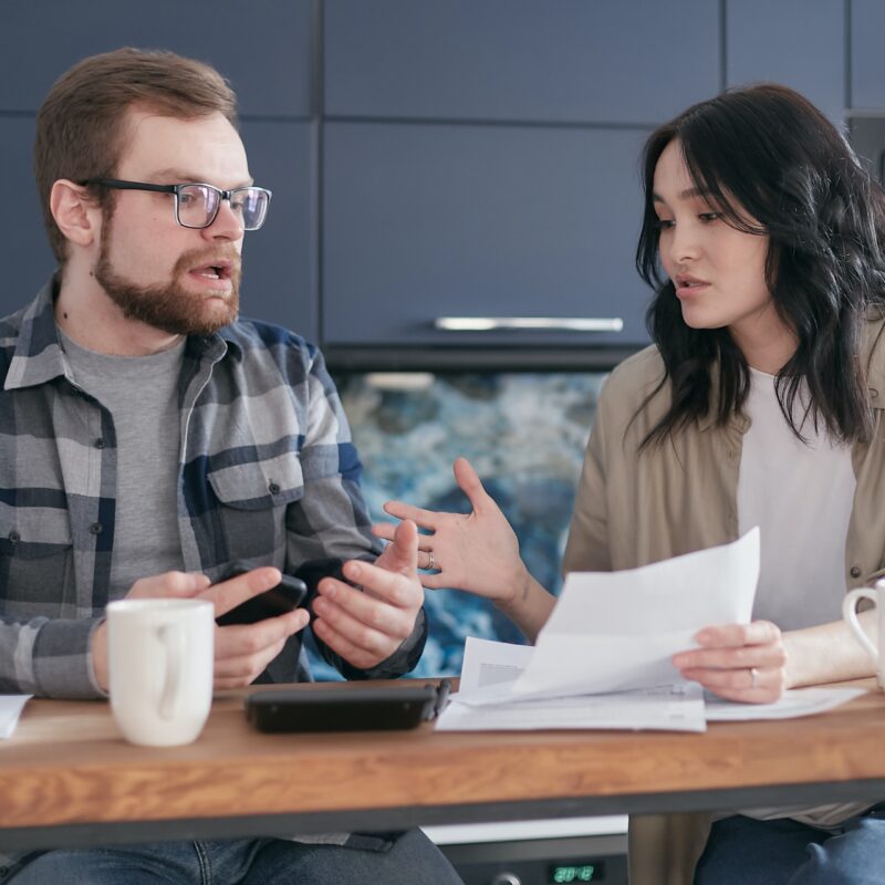 man and woman disagreeing about work